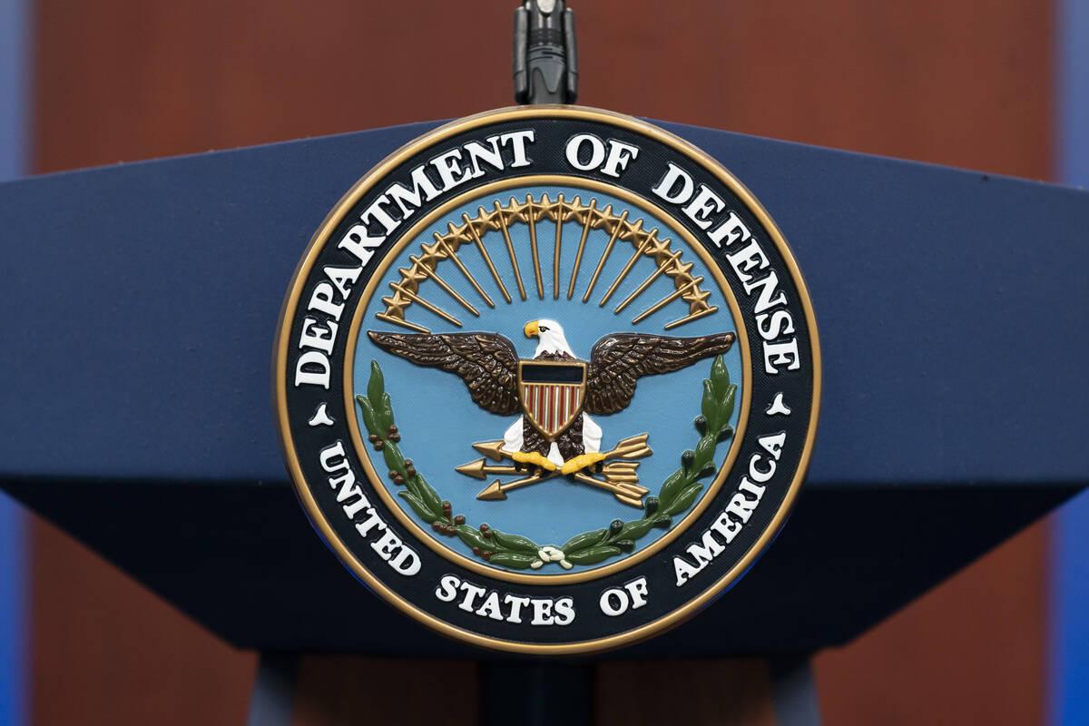 FILE - The seal of the Department of Defense is seen on the podium at the Pentagon, Sept. 27, 2 ...