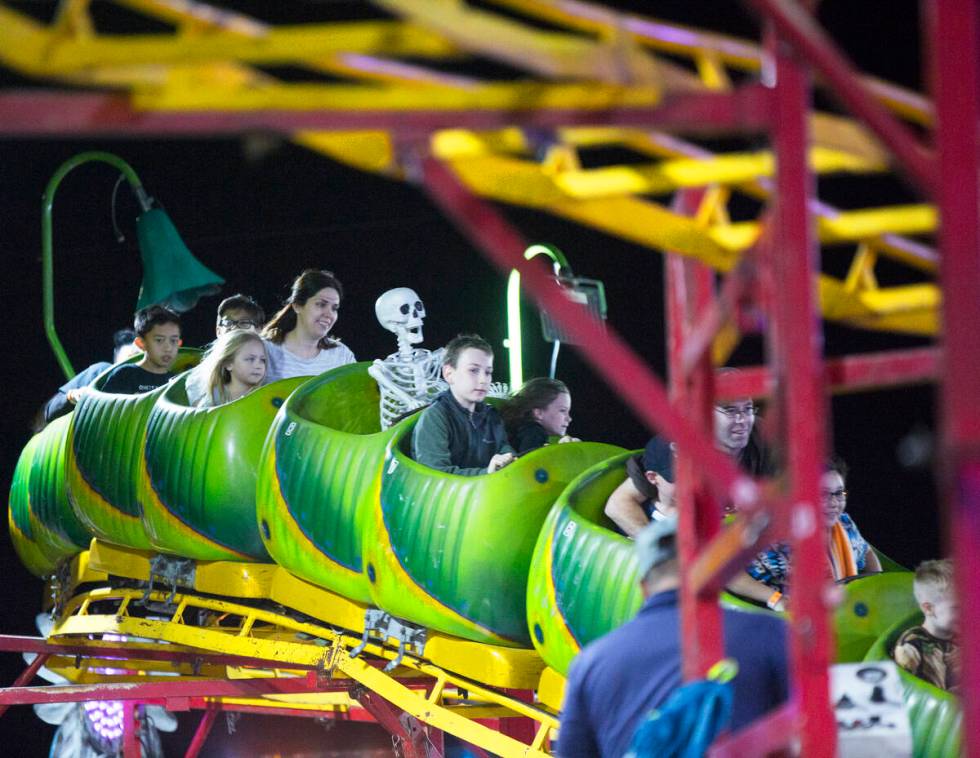 Attendees enjoy the Wacky Worm Coaster at HallOVeen on Monday, Oct. 22, 2018, at Opportunity ...