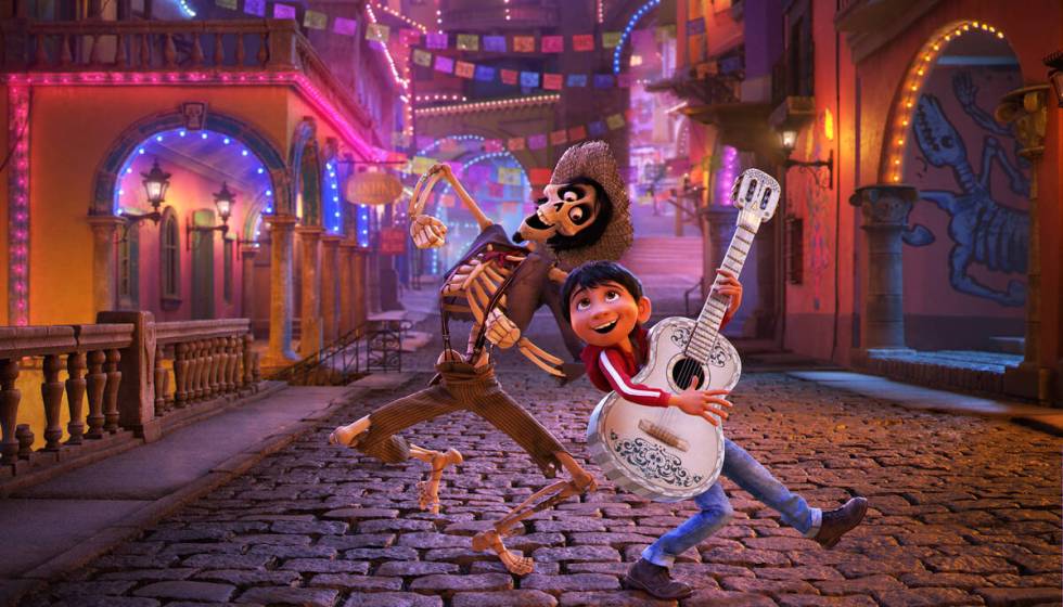 In this image released by Disney/Pixar, character Hector, voiced by Gael Garcia Bernal, left, a ...