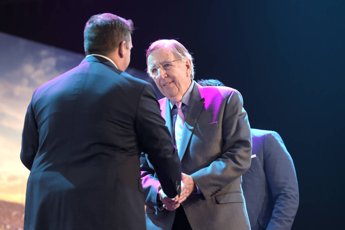 Broadcaster and Las Vegas Bowl Hall of Fame inductee Brent Musburger is greeted during a lunche ...