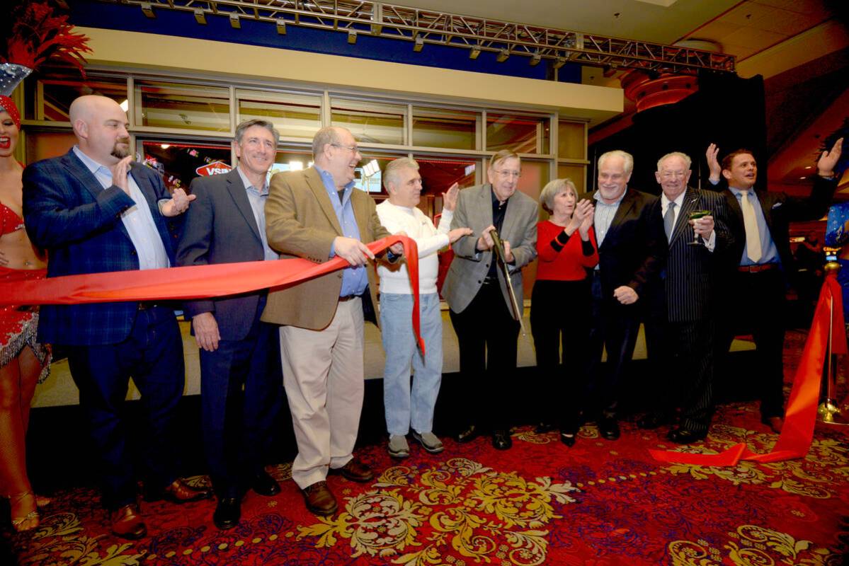 Sportscaster Brent Musburger cuts the ribbon for the VSiN sports network studio in the South Po ...