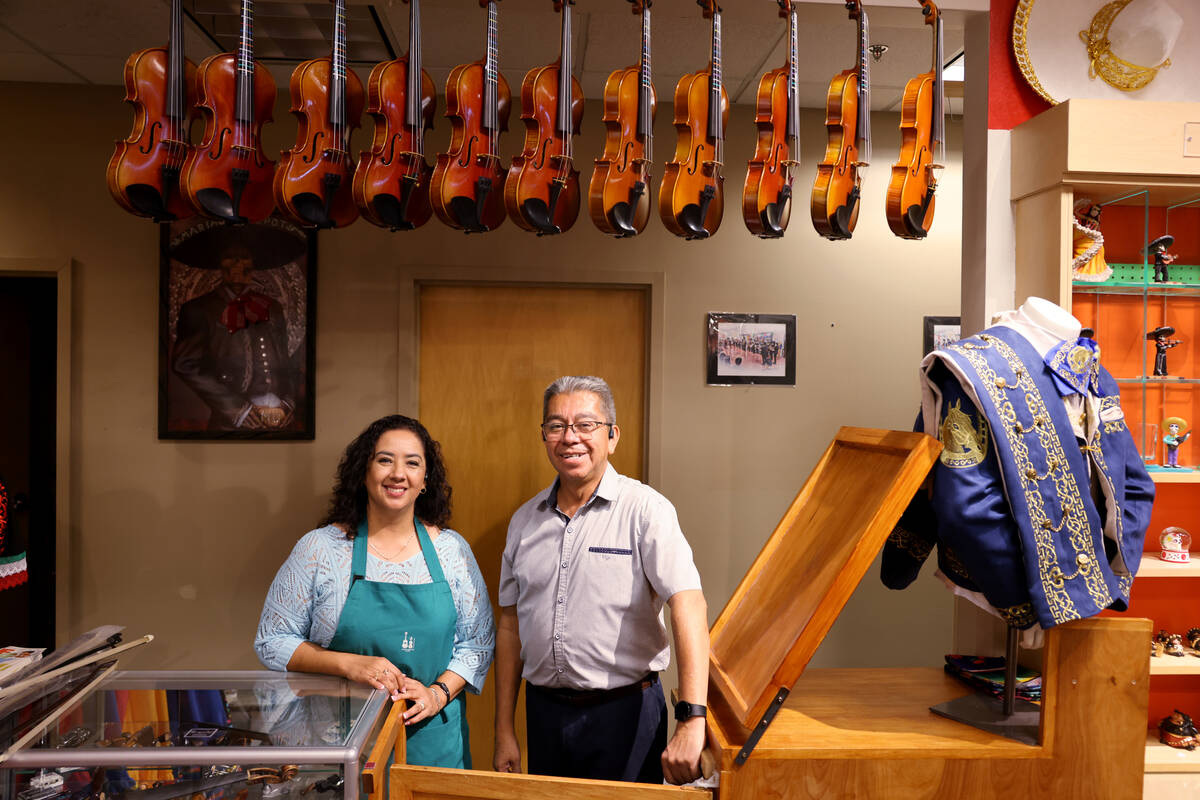 Claudia Rivera and Juan Soto, co-owners of Mariachi Depot, pose at their store at Boulevard Mal ...