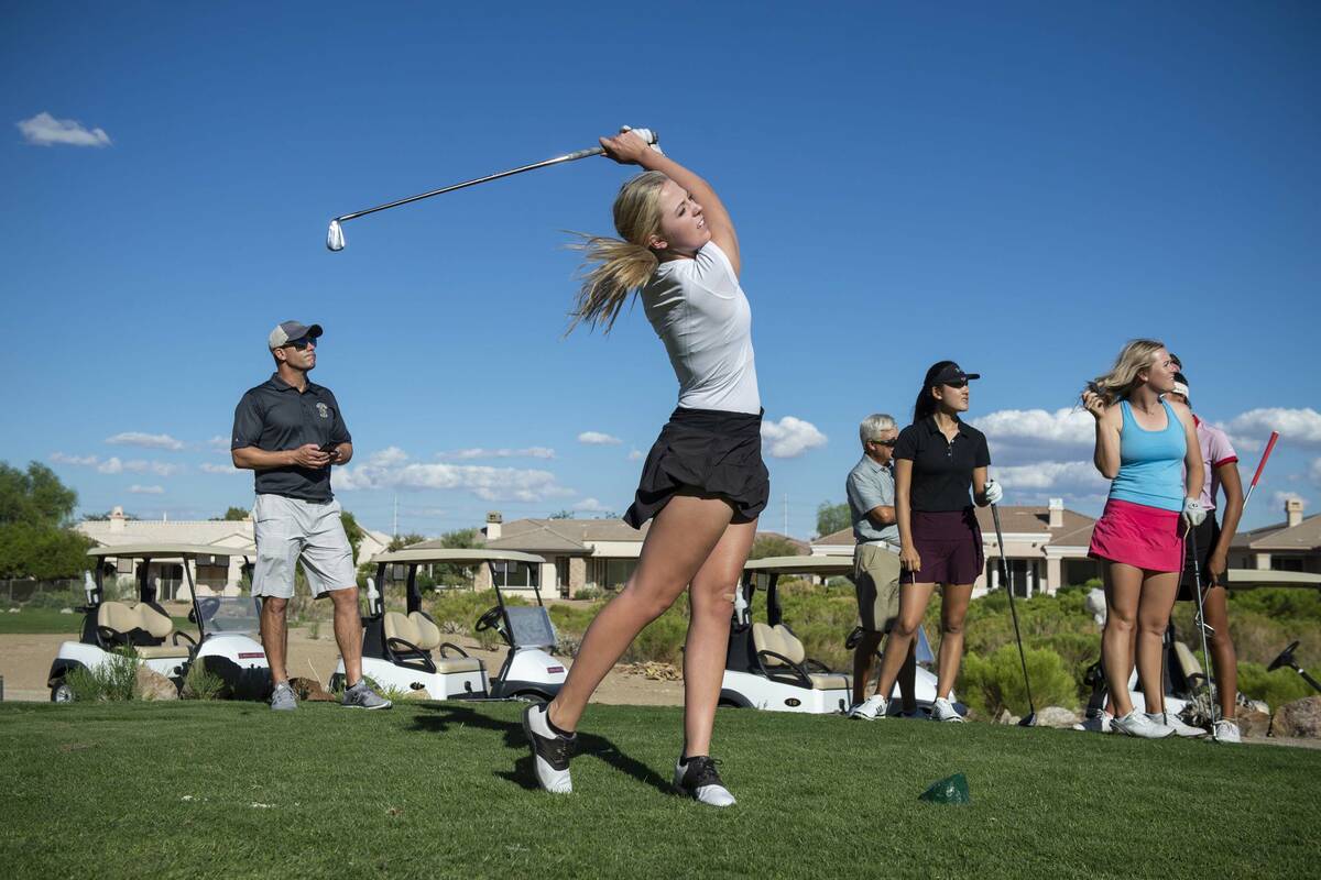 Faith Lutheran High School golfer Grace Olkowski hits a shot during practice at the Siena Golf ...