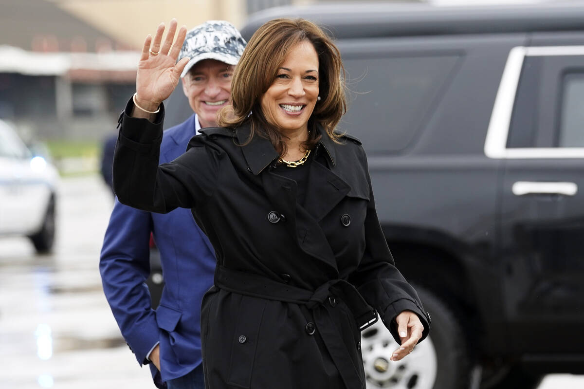 Democratic presidential nominee Vice President Kamala Harris smiles next to Sen. Mark Kelly, D- ...