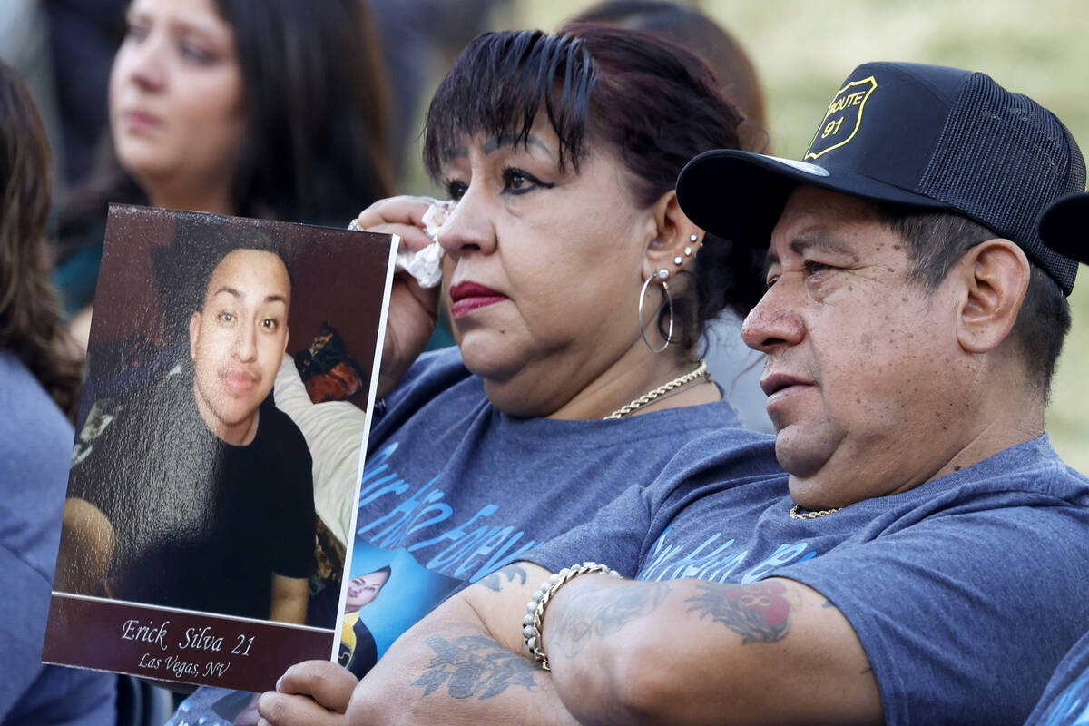 Angelica Cervantes holds a photograph of her son Eric Silva, the Oct. 1 shooting victim, as she ...