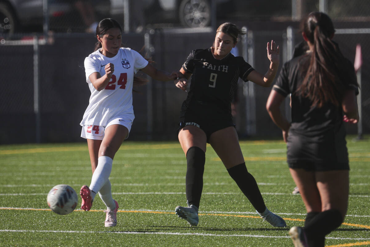 Coronado's Asia Moises (24) kicks the ball under pressure from Faith Lutheran's Leila Armstrong ...