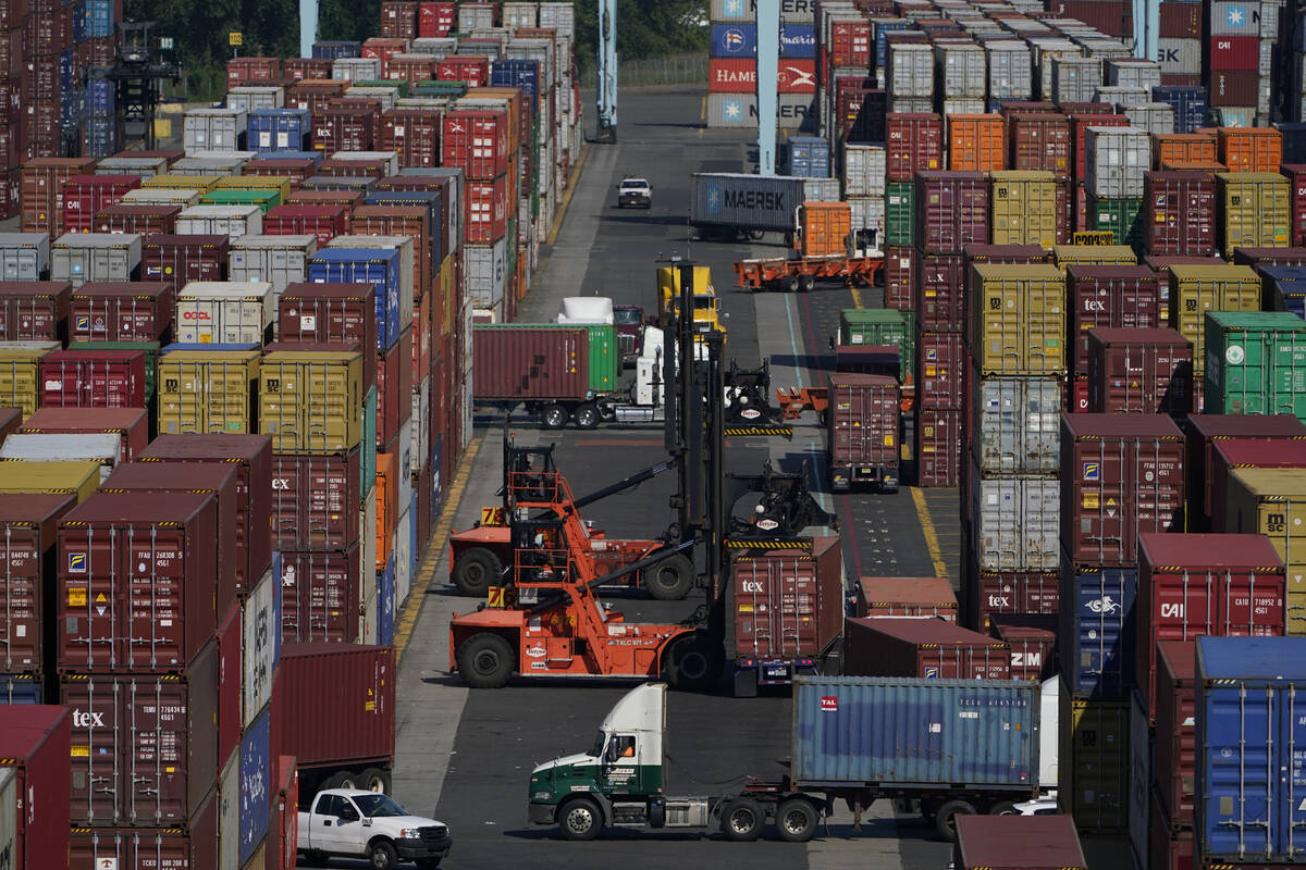 Containers are moved at the Port of New York and New Jersey in Elizabeth, N.J., on June 30, 202 ...