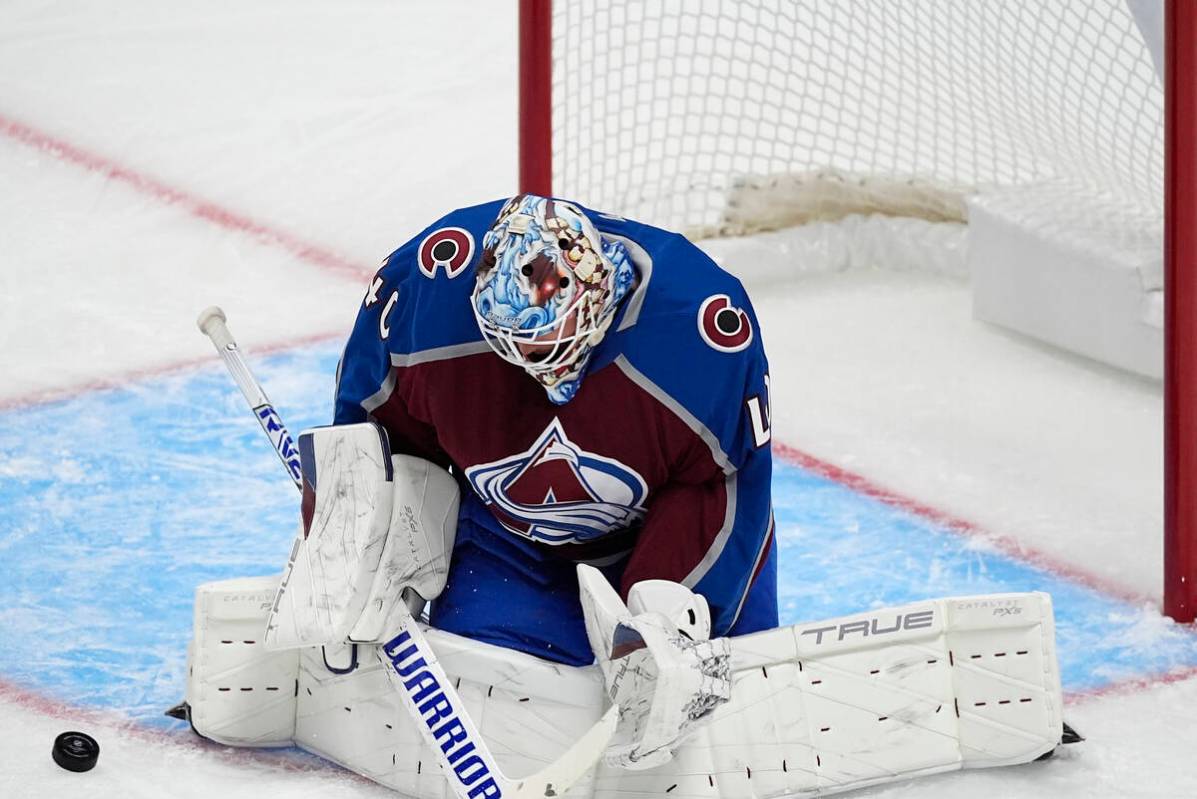 Colorado Avalanche goaltender Alexandar Georgiev stops a shot in the first period of an NHL pre ...