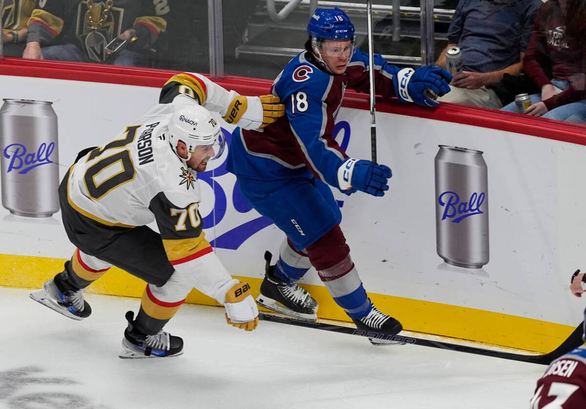 Vegas Golden Knights winger Tanner Pearson, left, checks Colorado Avalanche defenseman Jack Ahc ...