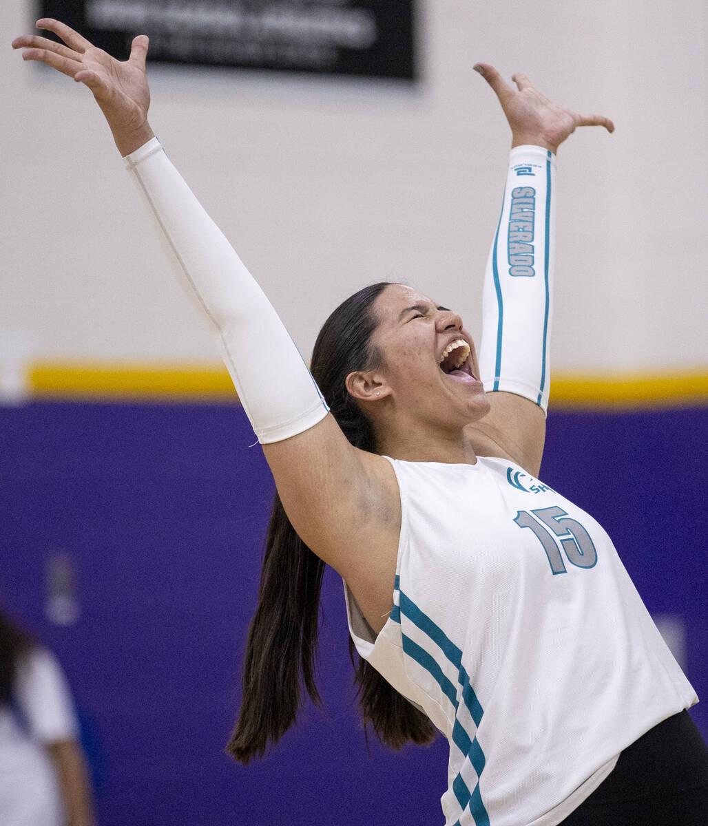 Silverado junior Kalia Roberts (15) celebrates gaining a point during the high school volleybal ...