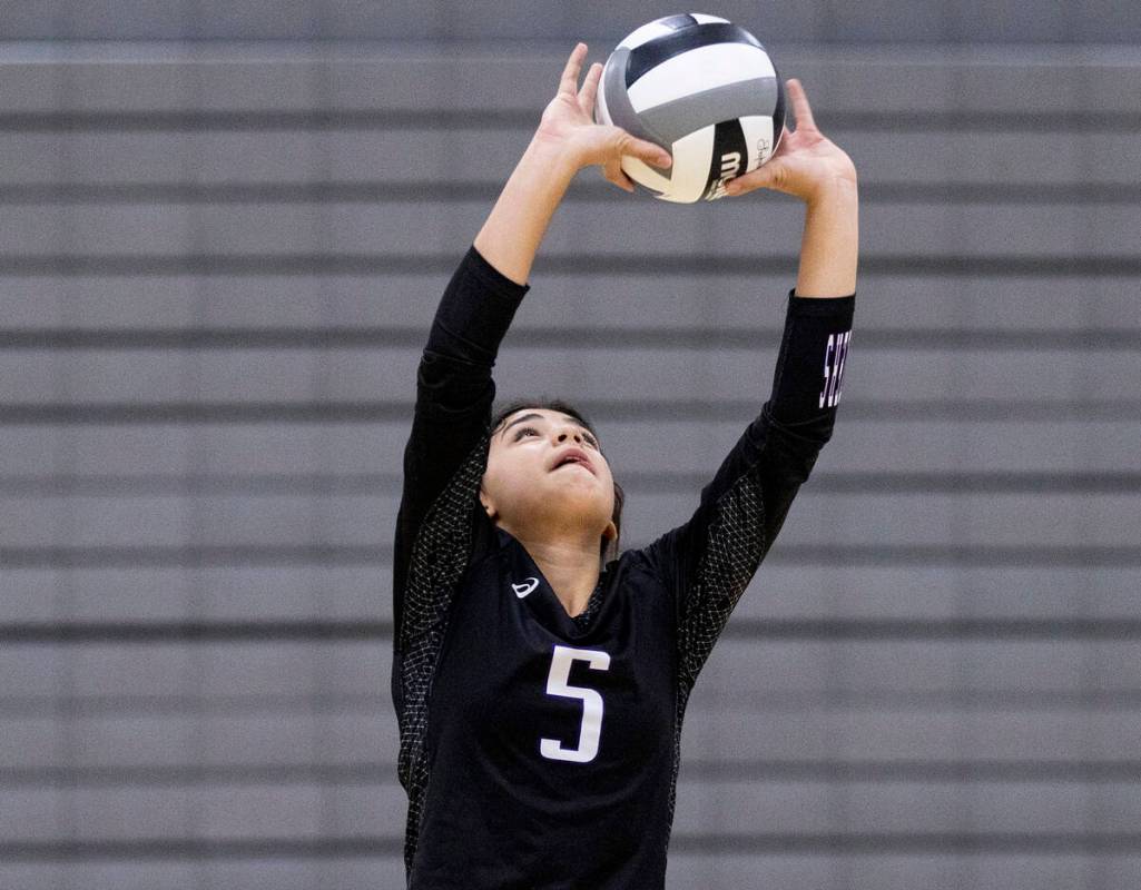 Durango junior Maya Dominguez (5) sets the ball during the high school volleyball game against ...