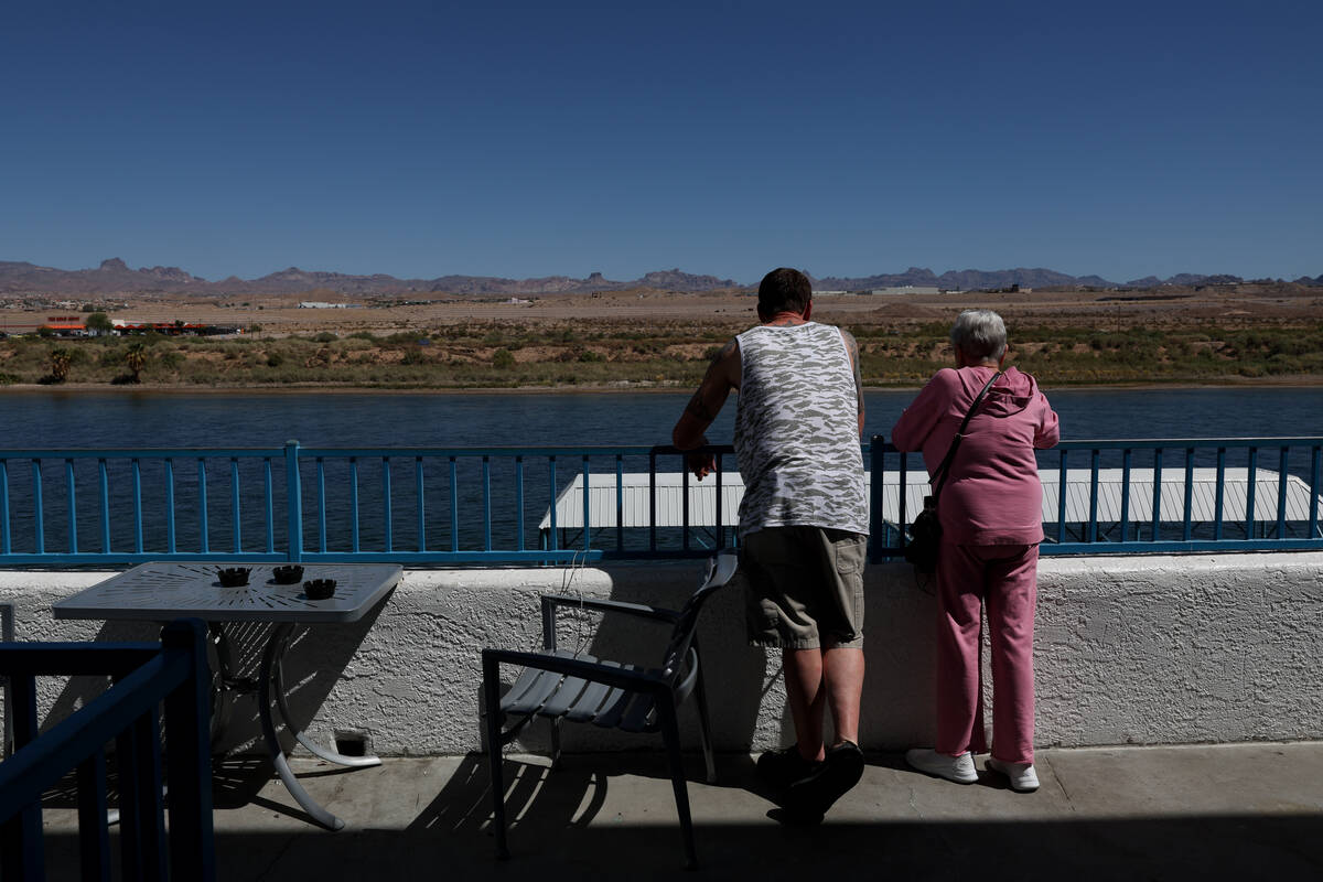 Guests look onto the Colorado River from a patio at Edgewater casino-resort on Tuesday, Sept. 1 ...