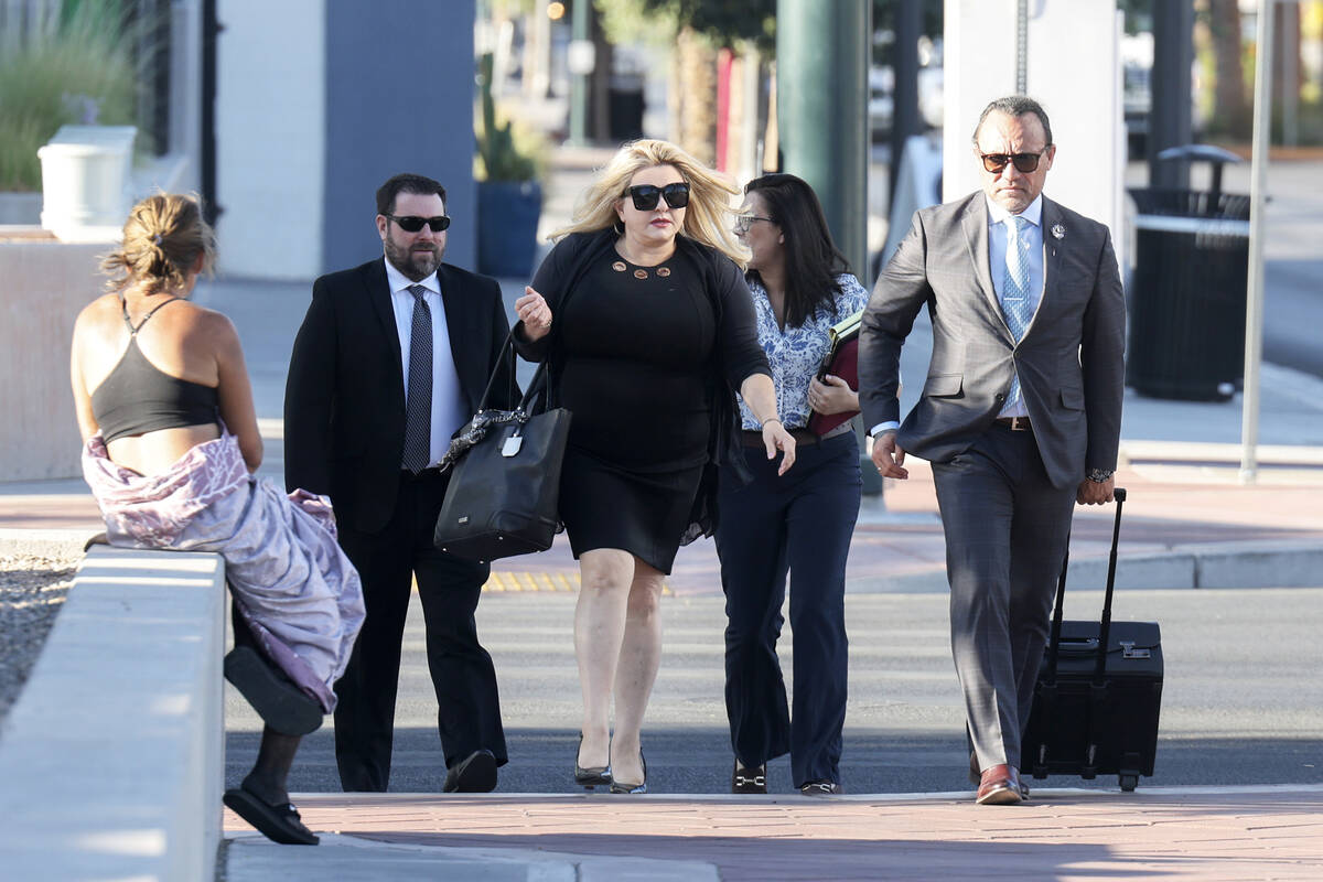 Former Las Vegas City Councilwoman Michele Fiore, center, arrives for her wire fraud trial at t ...