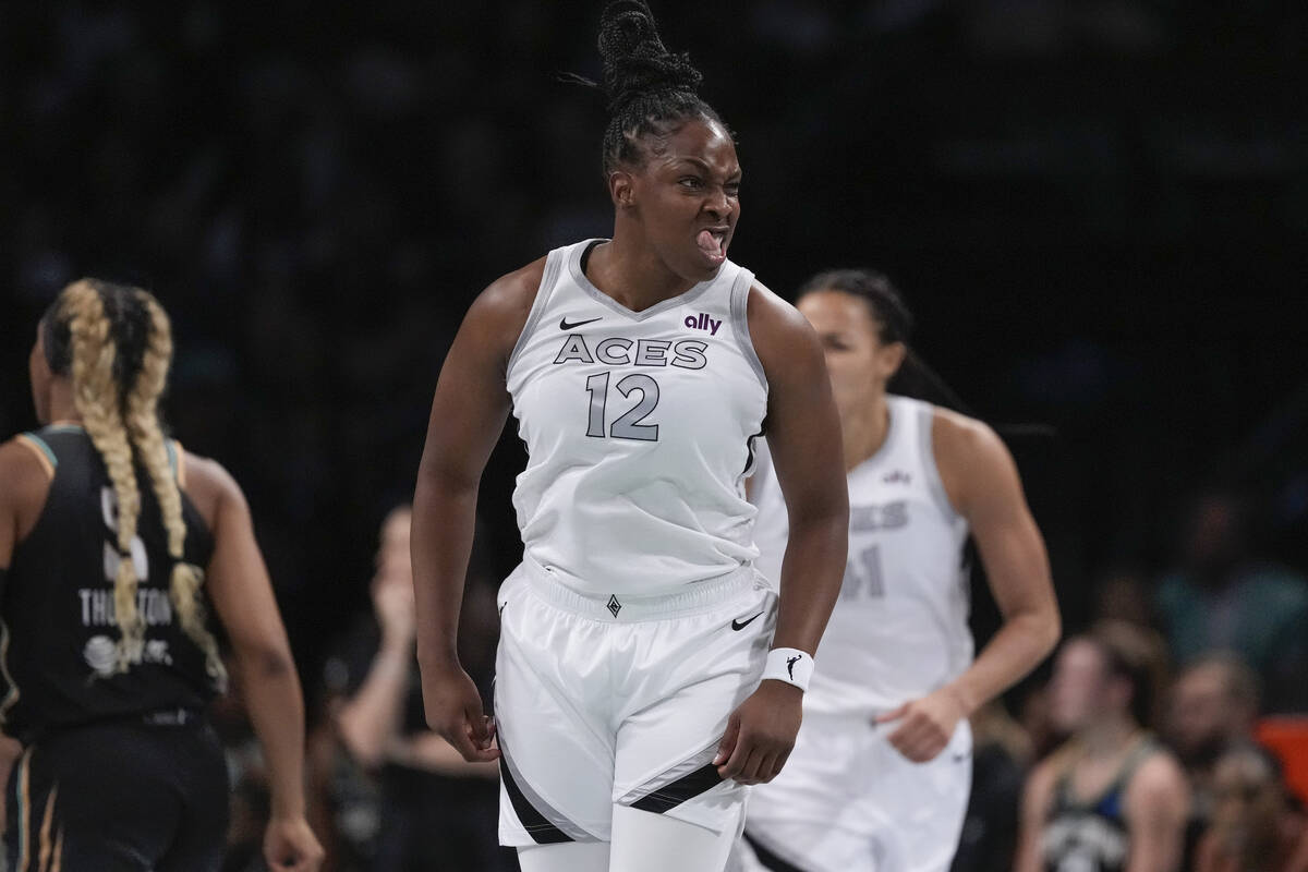 Las Vegas Aces' Chelsea Gray (12) gestures after scoring during the first half of a WNBA basket ...