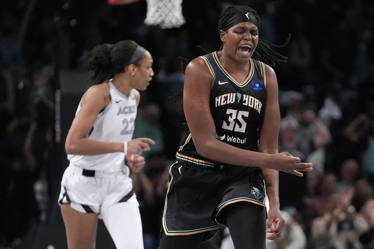 New York Liberty's Jonquel Jones (35) celebrates after making a three-point shot as Las Vegas A ...