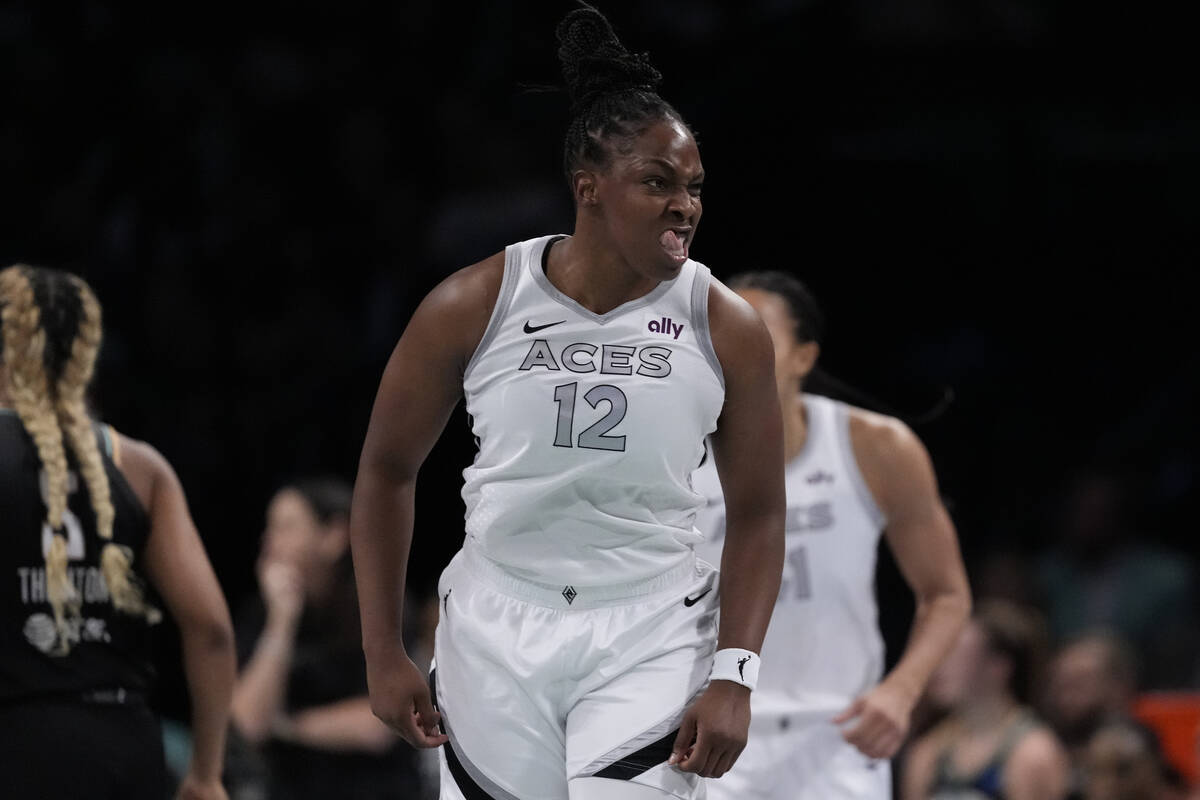 Las Vegas Aces' Chelsea Gray (12) gestures after scoring during the first half of a WNBA basket ...