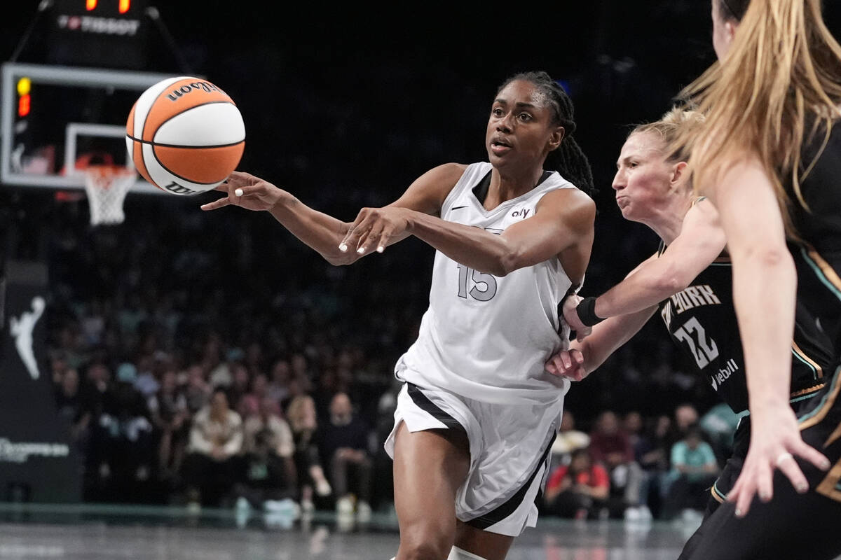 Las Vegas Aces' Tiffany Hayes (15) passes away from New York Liberty's Courtney Vandersloot (22 ...