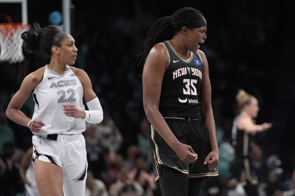 New York Liberty's Jonquel Jones (35) celebrates after making a three-point shot as Las Vegas A ...