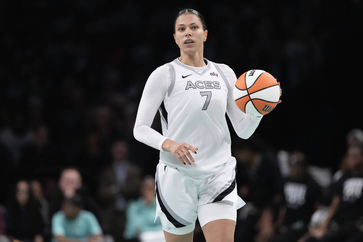 Las Vegas Aces' Alysha Clark (7) looks to pass during the second half of a WNBA basketball semi ...