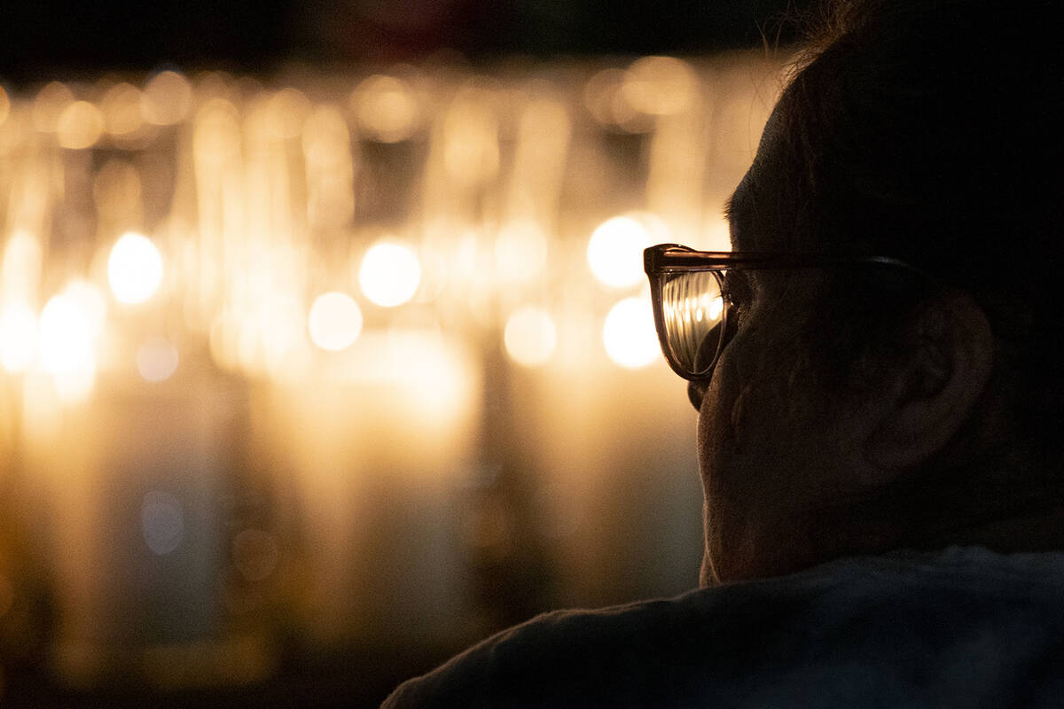 A mourner attends the candlelight vigil to remember those who perished during the events of Oct ...