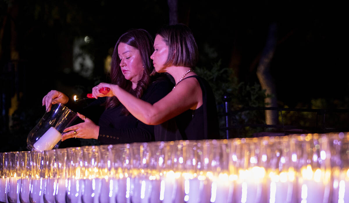 A candle is lit to remember each of the 58 victims who perished during the events of Oct. 1, 20 ...