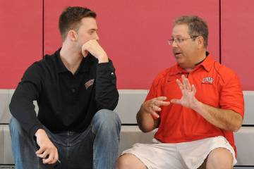 UNLV play-by-play broadcaster Jon Sandler, right, talks to Katin Reinhardt talks at the Mendenh ...