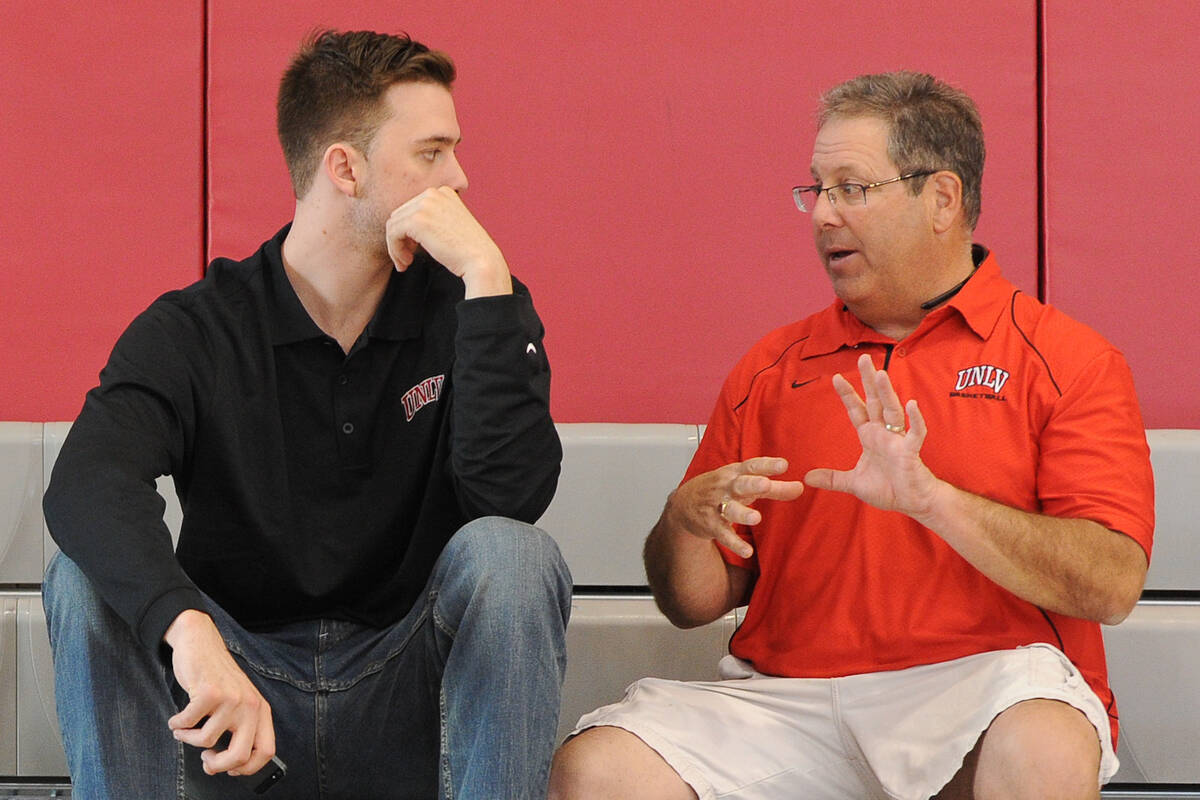 UNLV play-by-play broadcaster Jon Sandler, right, talks to Katin Reinhardt talks at the Mendenh ...