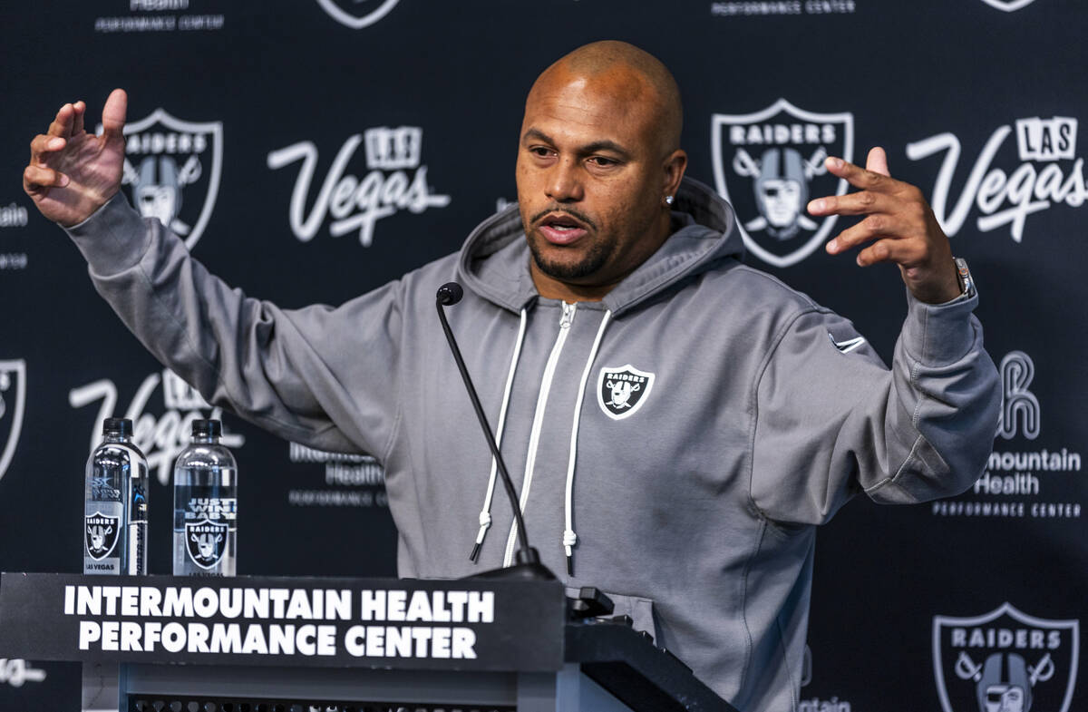 Raiders head coach Antonio Pierce answers a question during a media interview before practice a ...