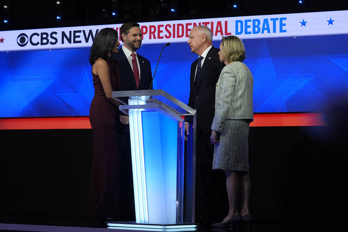 Republican vice presidential nominee Sen. JD Vance, R-Ohio, and his wife Usha Vance talk with D ...