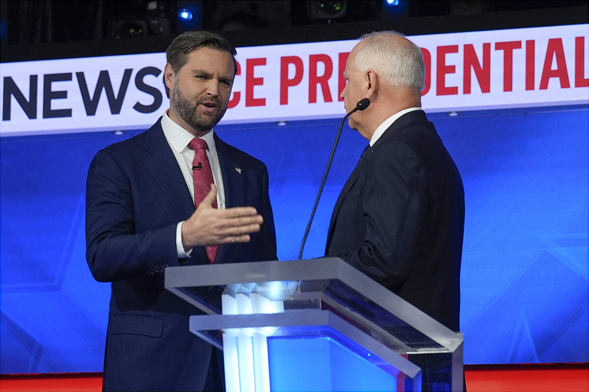 Republican vice presidential nominee Sen. JD Vance, R-Ohio, talks with Democratic vice presiden ...