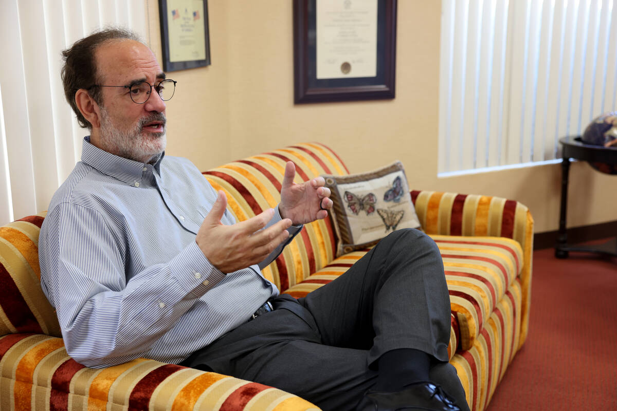 Rabbi Sanford Akselrad of Congregation Ner Tamid in Henderson talks to a reporter about the upc ...