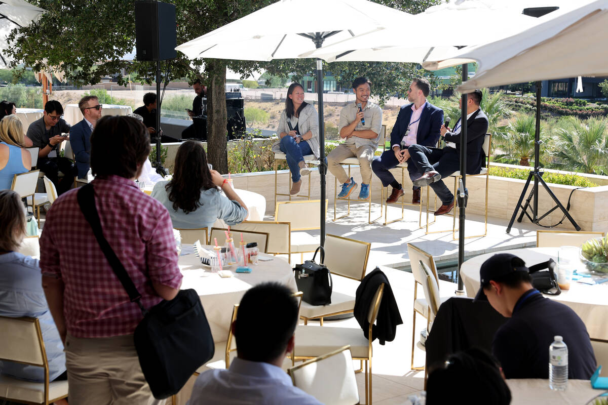 Tech entrepreneurs, CEOs and company founders listen to panelists, from left, Linda Tong, CEO a ...