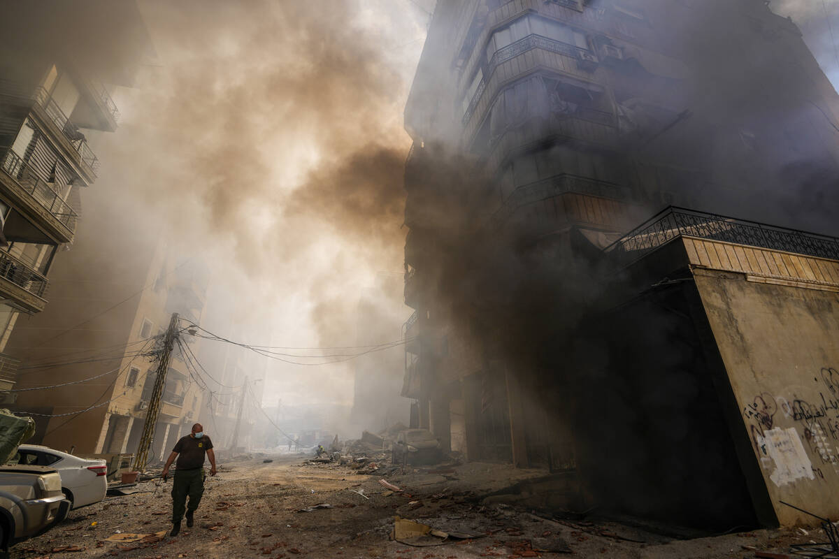 Smoke rises from the site of an Israeli airstrike in Dahiyeh, Beirut, Lebanon, Wednesday, Oct. ...