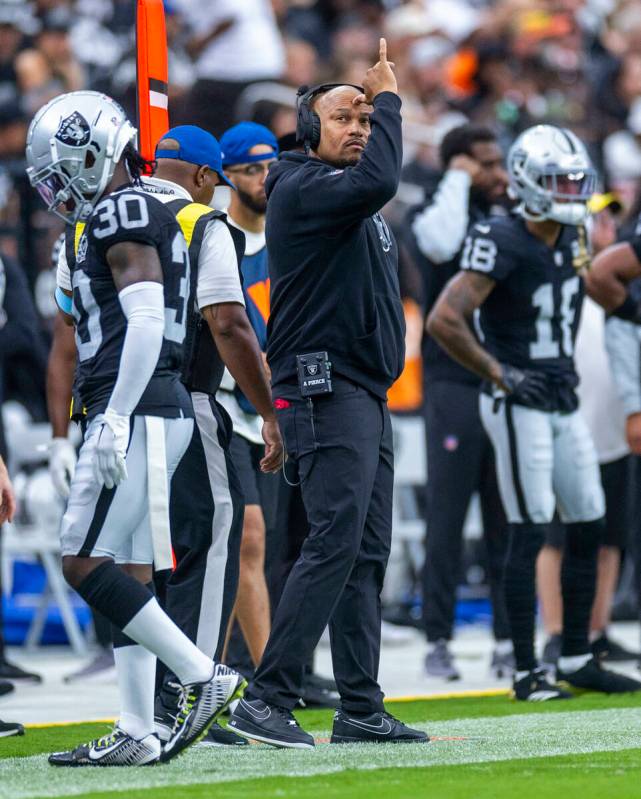 Raiders Head Coach Antonio Pierce signals his players against the Cleveland Browns during the f ...