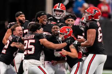 Atlanta Falcons players celebrate place kicker Younghoe Koo's game-winning 58-yard-field goal a ...