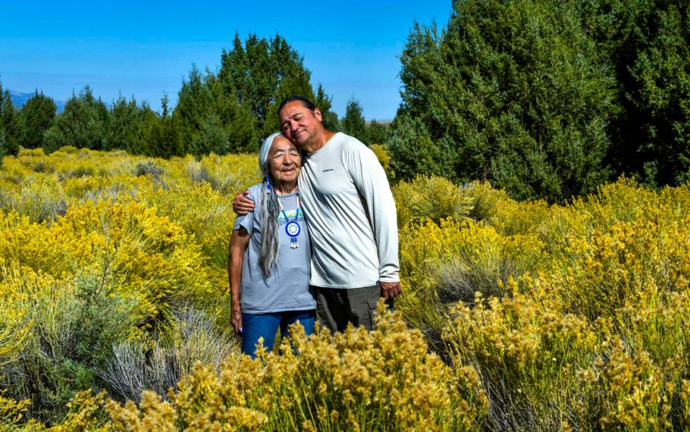 Delaine and Rick Spilsbury stand amongst Bahsahwahbee, a grove of Rocky Mountain juniper trees ...