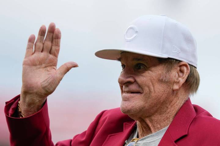 Former Cincinnati Reds player Pete Rose waves to fans after being introduced during the Reds Ha ...