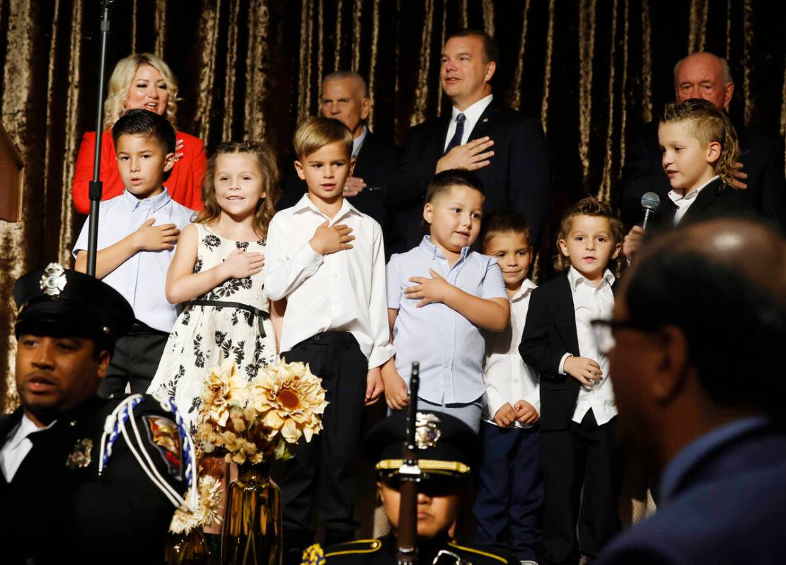 Henderson Mayor Michelle Romero, top left, watches as her grandchildren recite the Pledge of Al ...