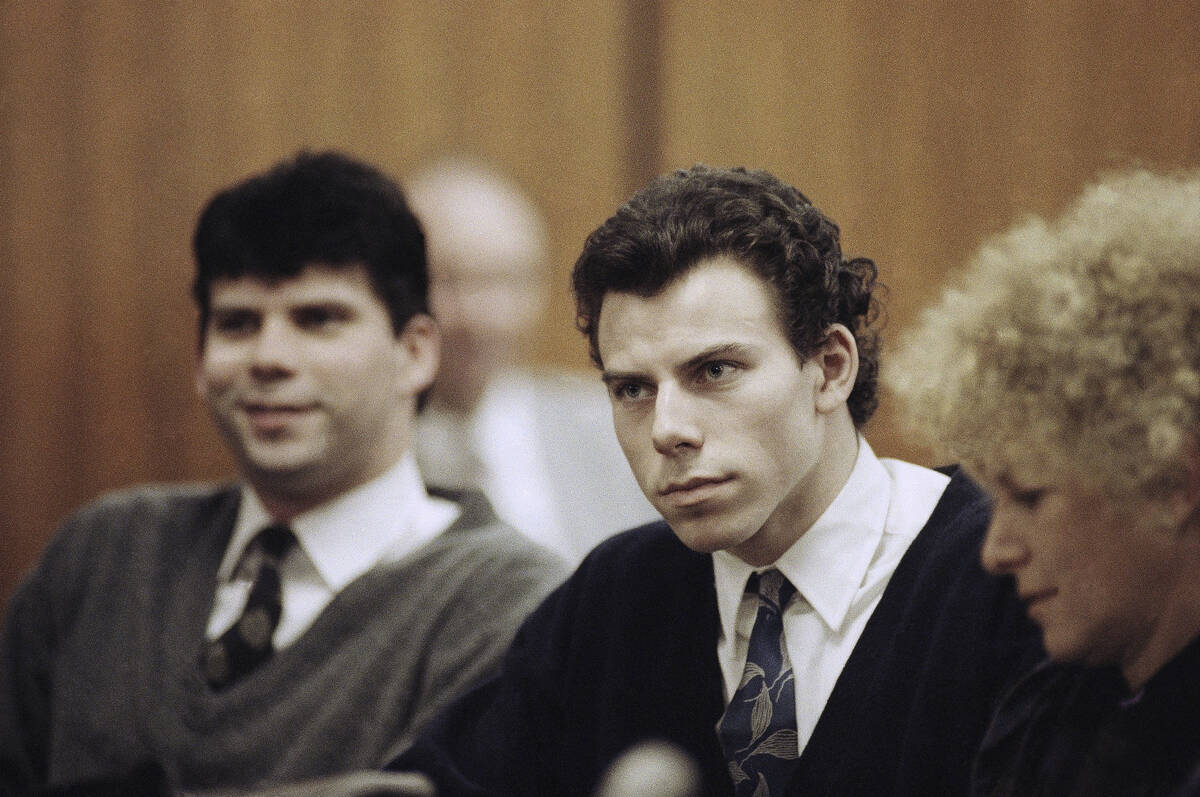 FILE - Lyle, left, and Erik Menendez sit with defense attorney Leslie Abramson, right, in Bever ...