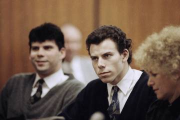 FILE - Lyle, left, and Erik Menendez sit with defense attorney Leslie Abramson, right, in Bever ...