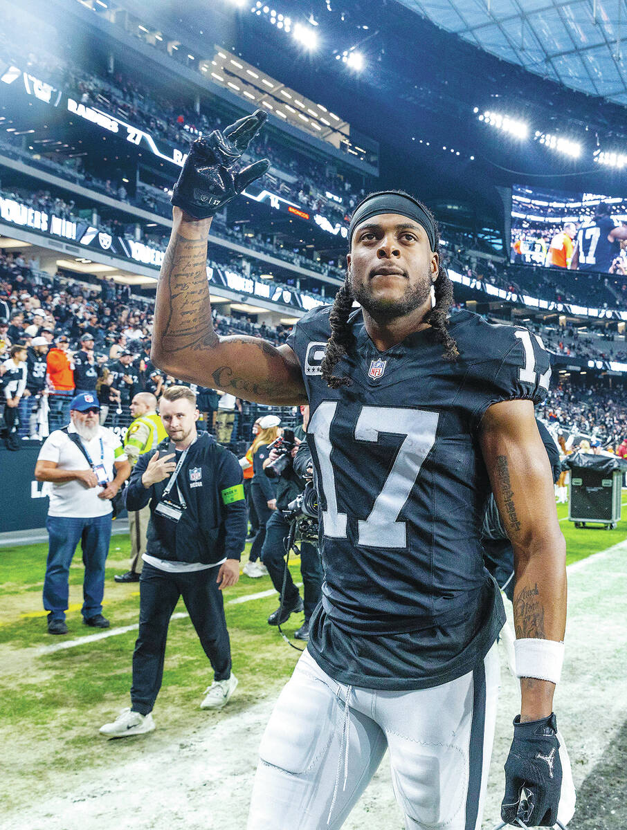 Raiders wide receiver Davante Adams (17) greets fans after defeating the Denver Broncos 27-14 f ...