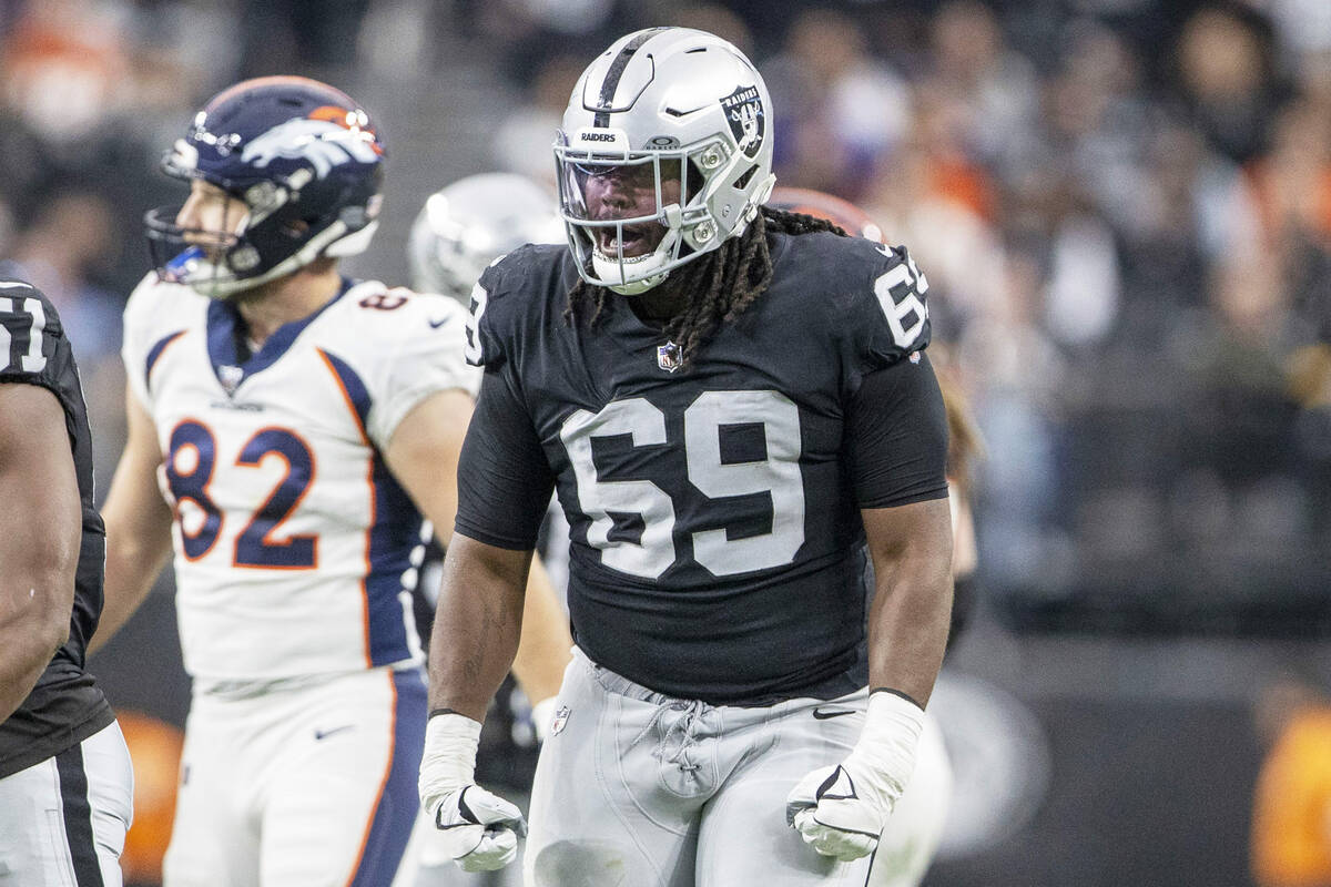 Raiders defensive tackle Adam Butler (69) reacts after a big defensive play against the Denver ...