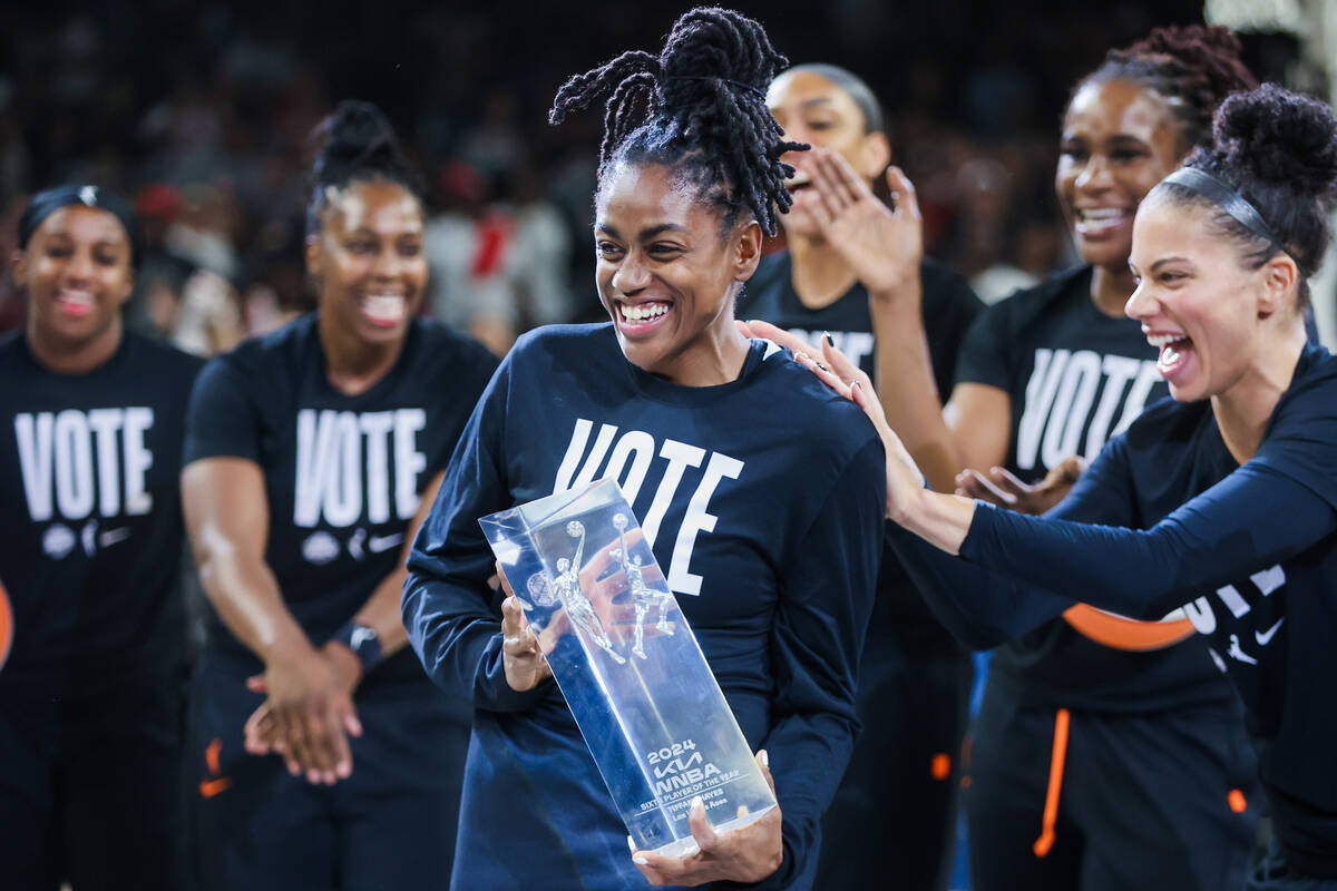 Aces guard Tiffany Hayes (15) celebrates winning the WNBA Sixth Person of the Year award during ...