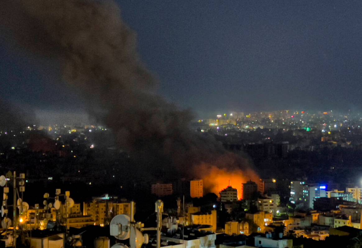 Flames and smoke rise from Israeli airstrikes in Dahiyeh, Beirut, Lebanon, Friday, Oct. 4, 2024 ...