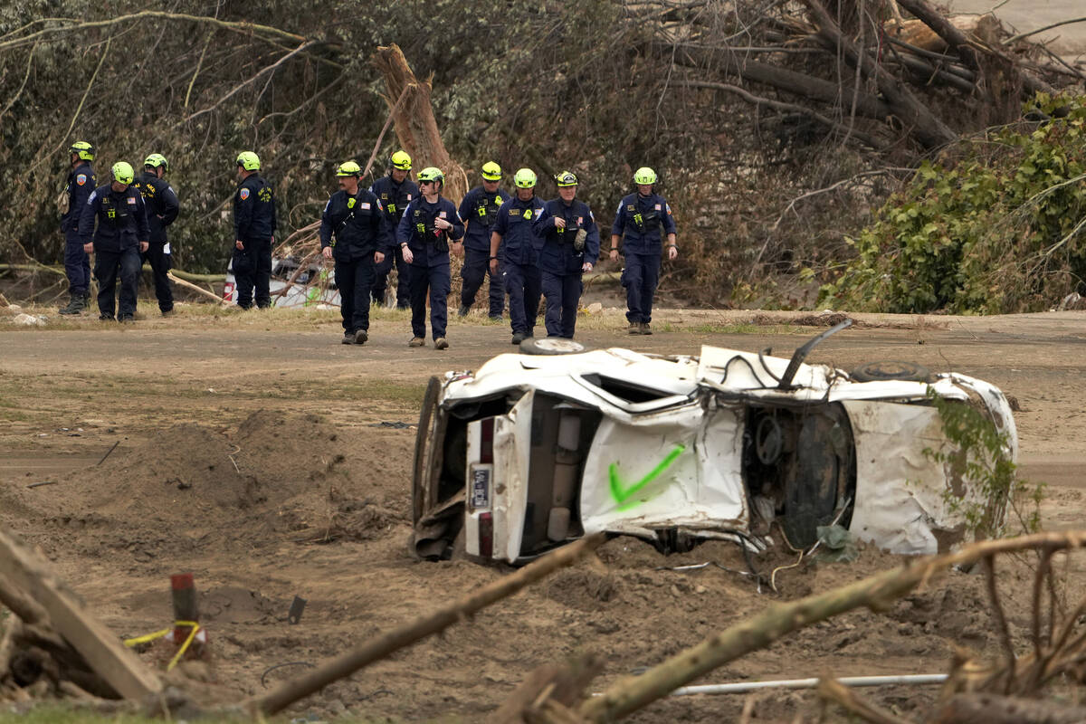 Personnel from Urban Search and Rescue Utah Task Force 1 work in the aftermath of Hurricane Hel ...