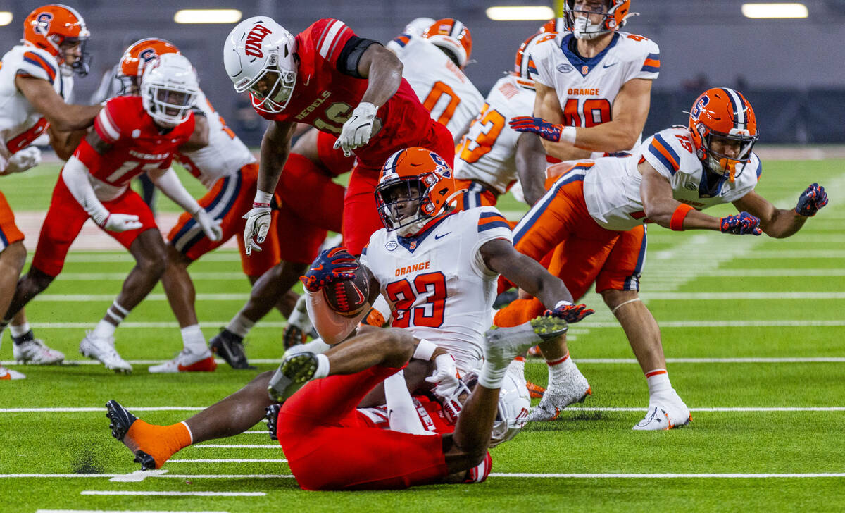 Syracuse Orange running back Yasin Willis (23) is tacked deep in his side of the field on a kic ...