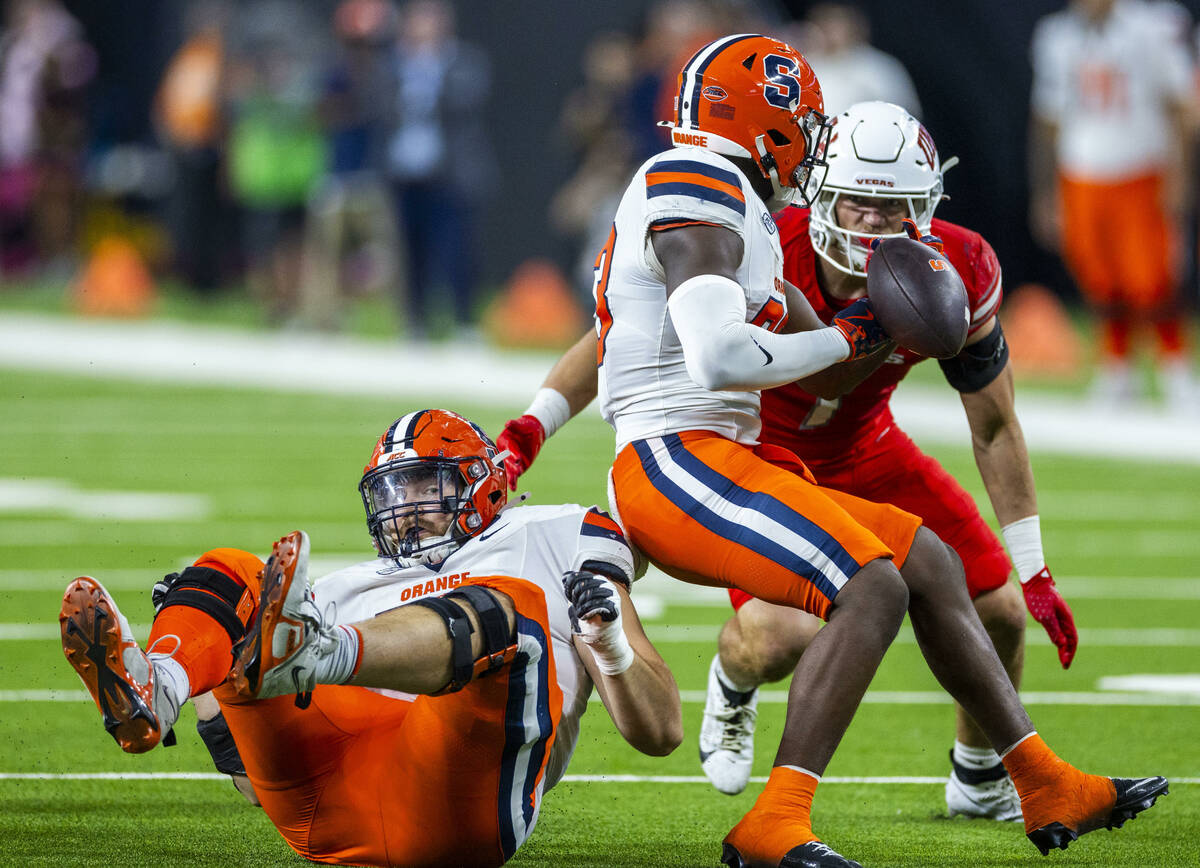 Syracuse Orange running back Yasin Willis (23) has the ball knocked away as UNLV defensive back ...