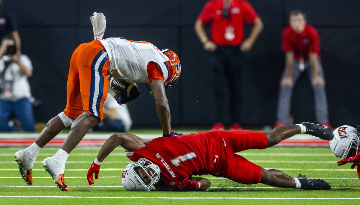 UNLV defensive back Jalen Catalon (1) nearly makes a potential game-winning tackle on Syracuse ...