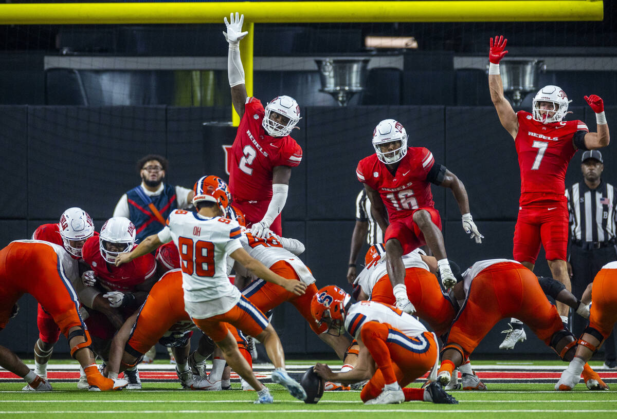 UNLV defensive end Antonio Doyle Jr. (2) with linebacker Mani Powell (16) and linebacker Jackso ...