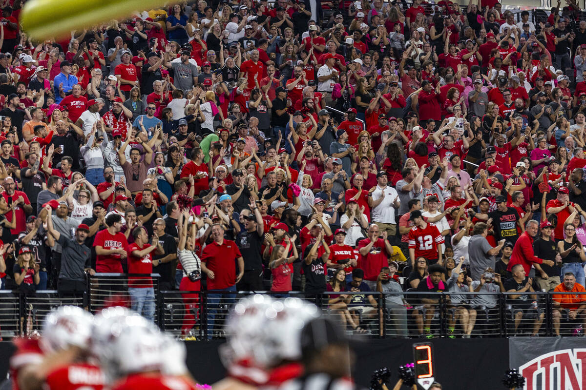 UNLV fans celebrate their first score of the night against the Syracuse Orange during the first ...